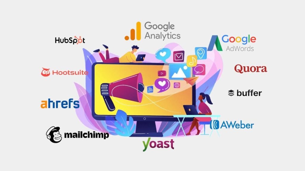 A digital marketing illustration featuring two professionals working on laptops around a large computer monitor. The screen displays a megaphone and various social media icons like hearts, envelopes, and music notes. Surrounding the central graphic are the logos of several industry-standard tools: HubSpot, Google Analytics, Google AdWords, Quora, Buffer, AWeber, Yoast, Mailchimp, ahrefs, and Hootsuite. The design uses a vibrant palette of purple, orange, and blue against a light gray background.